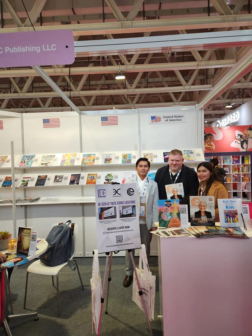 Collection of books and magazines showcased on a wall.